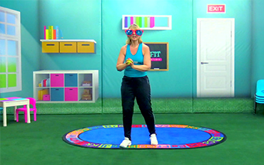 Michele in a virtual KID-FIT class with big sunglasses